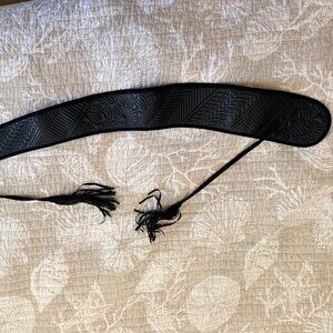 Women's embossed black leather belt with fringe ties
